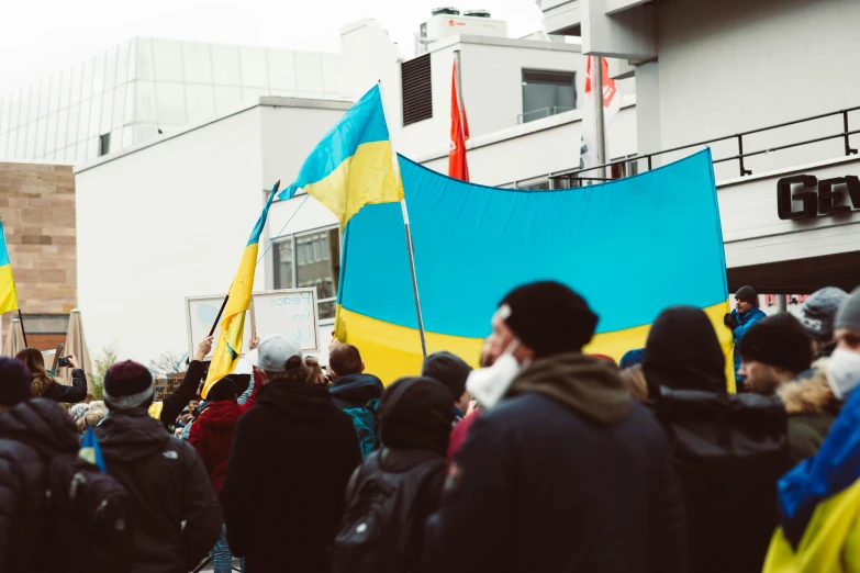 a person with a flag holding two other people