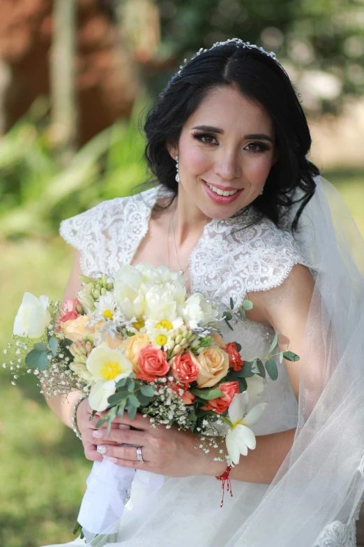 a beautiful young woman holding a bouquet of flowers