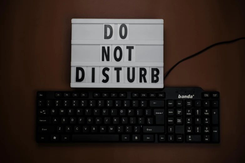 the word do not disturb next to a keyboard