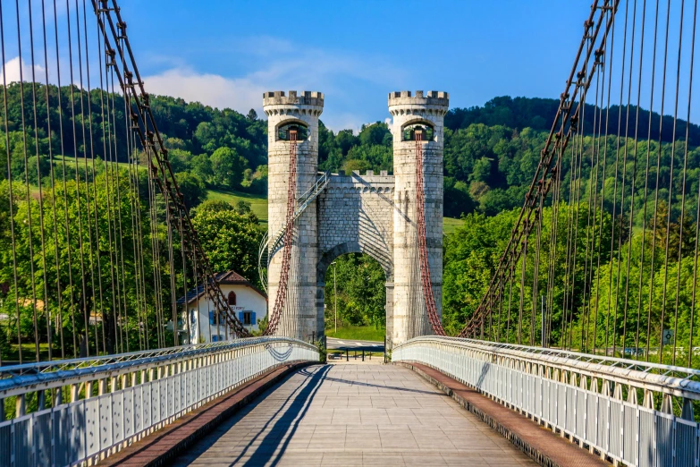 a bridge leading to an area with trees in the background