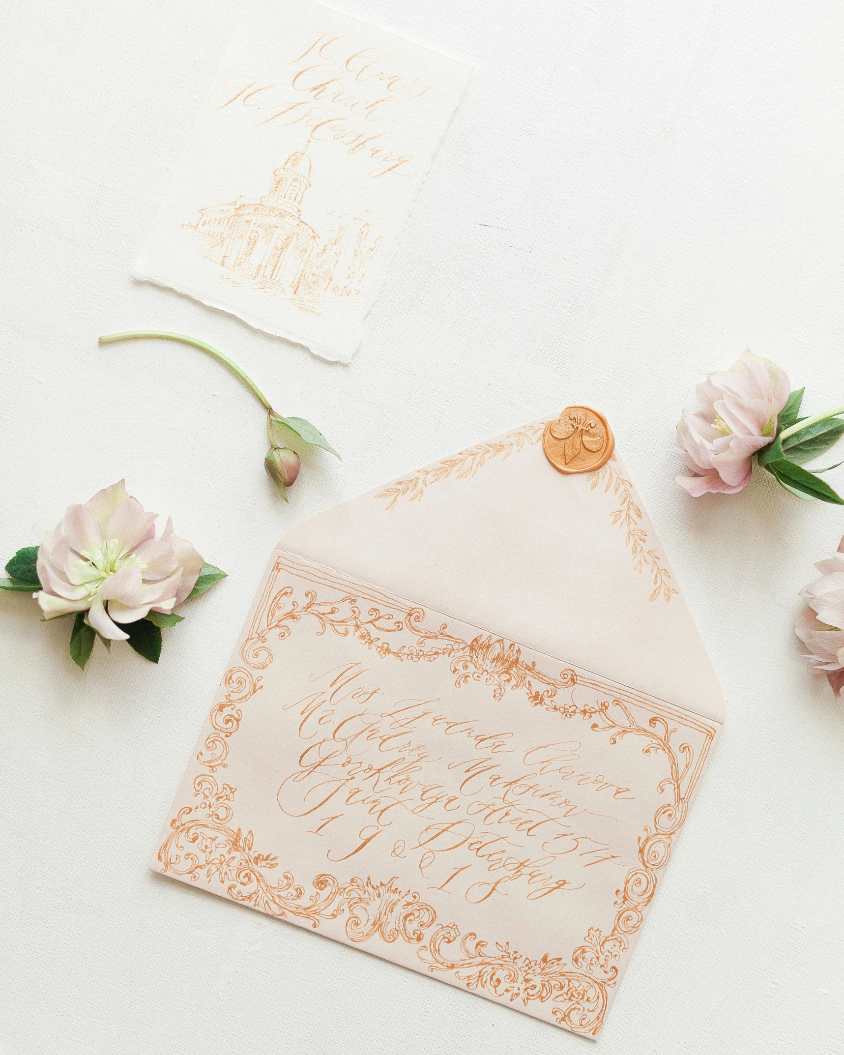 an assortment of wedding envelopes with the letters love and two flower bouquet