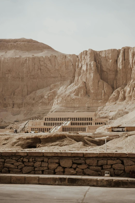 a group of mountains with a large building on the side