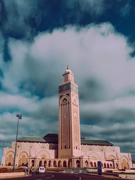 the front of a building with a large clock tower