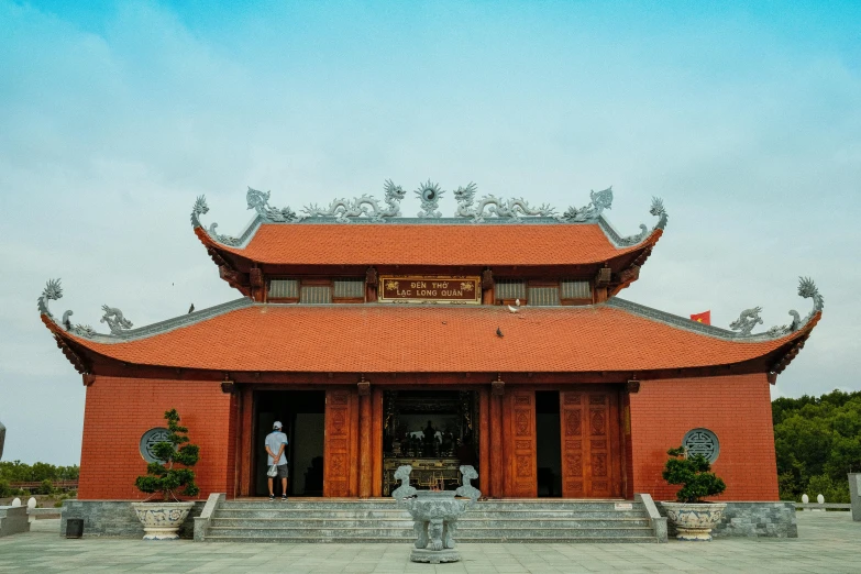 a red building with a blue sky in the background