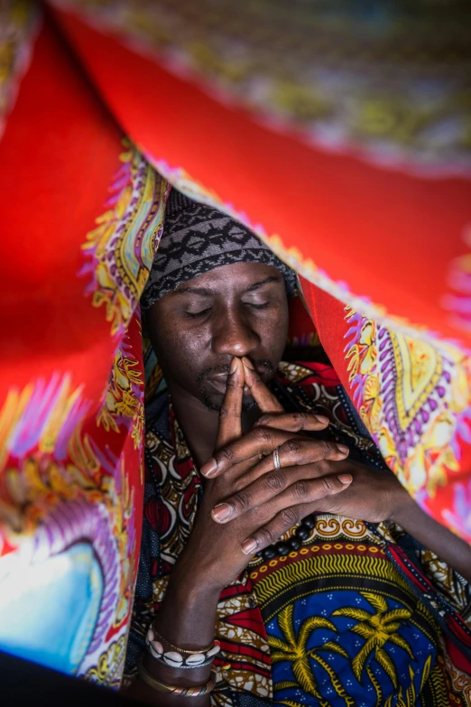 a woman smoking while lying her eyes on the ground