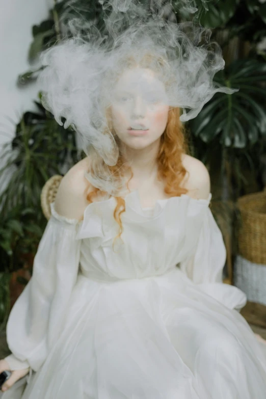 a woman in a white dress with smoke floating over her head