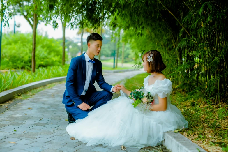 there is a young man and woman dressed in a dress