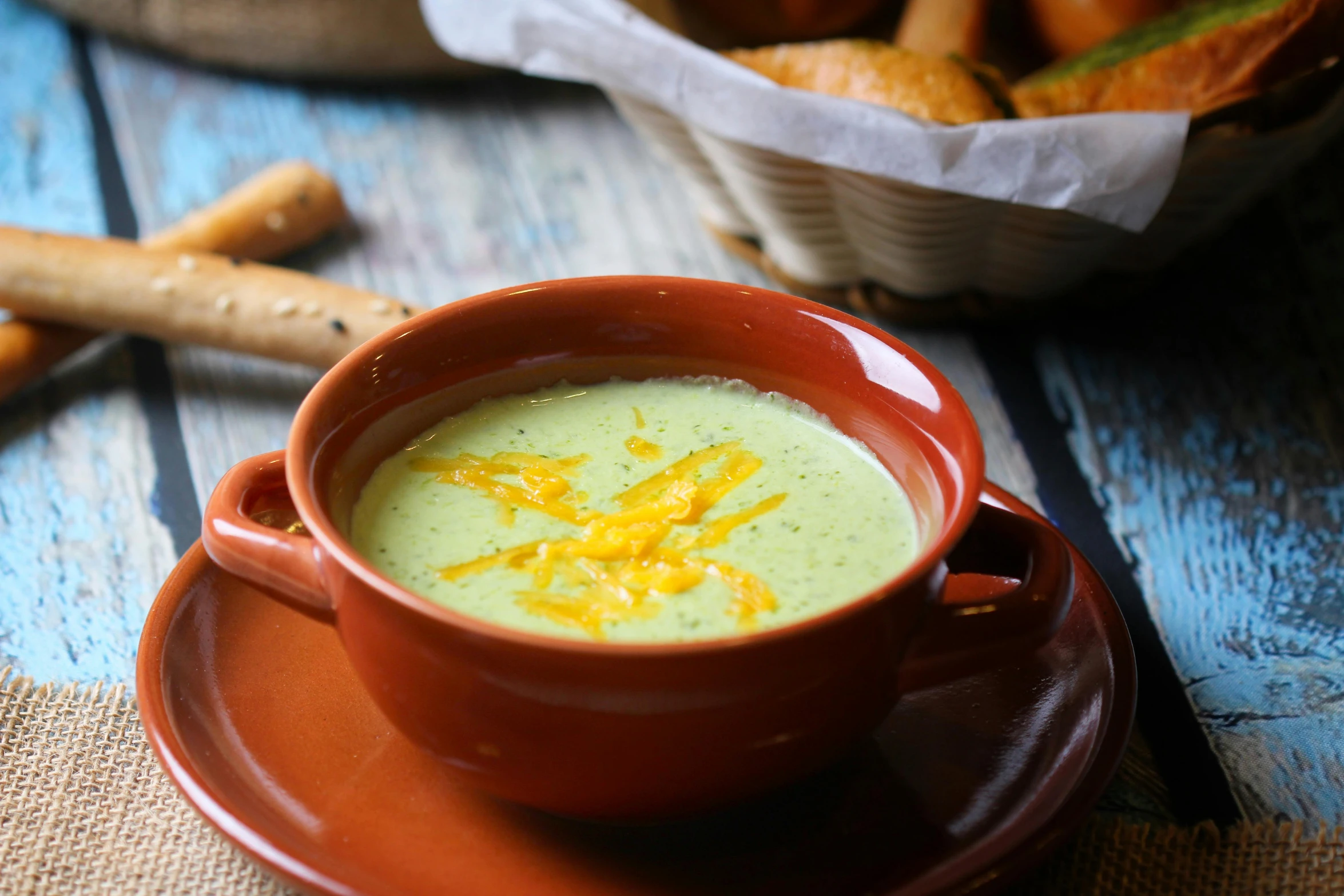 a red bowl of soup on a table