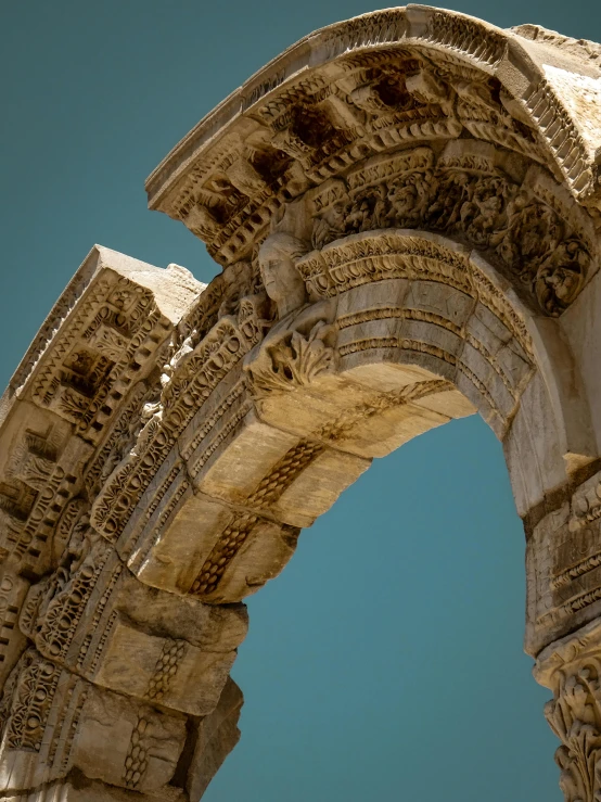 a very old stone archway with carvings on the side