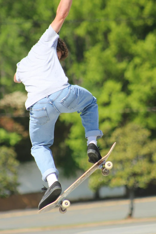 this skateboarder is doing a trick on his board