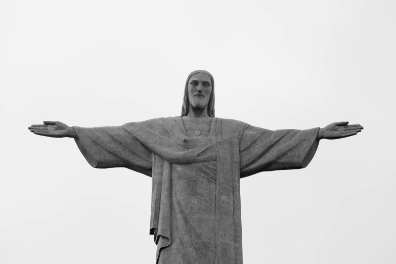 the statue is being watched by people from behind