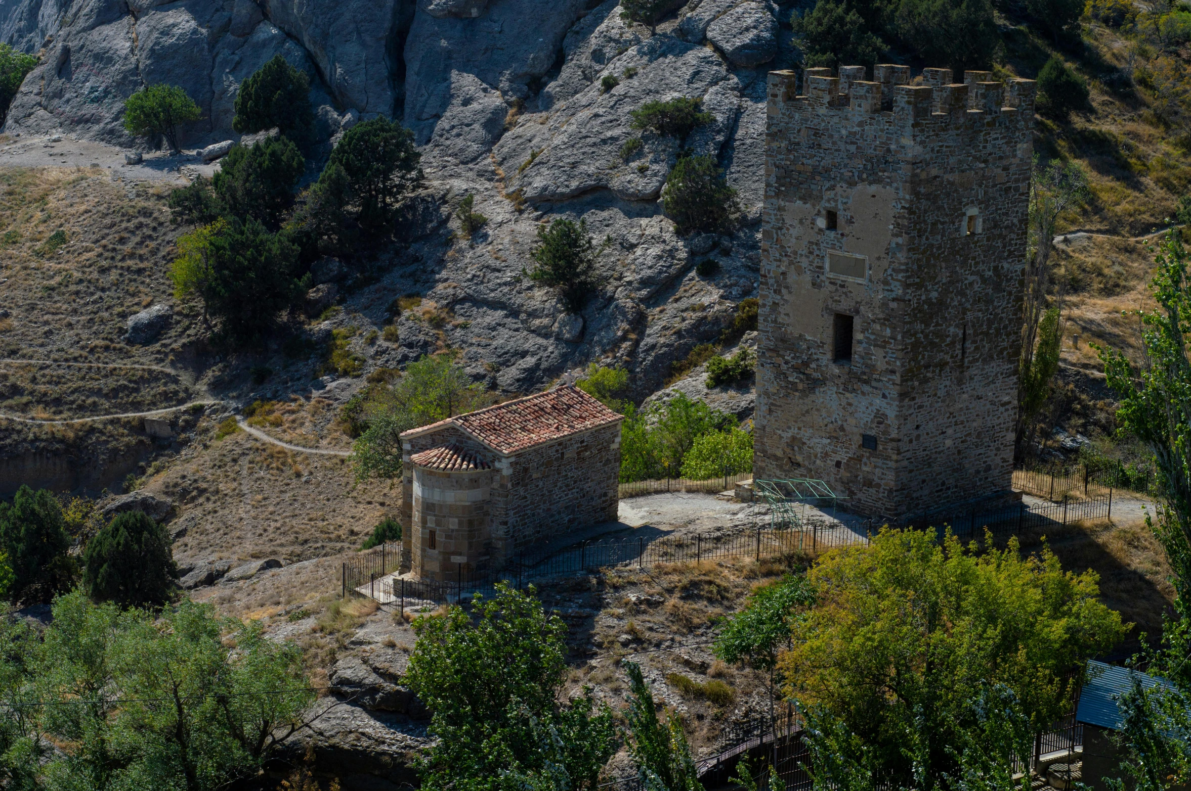 a very old, old style castle near a hill