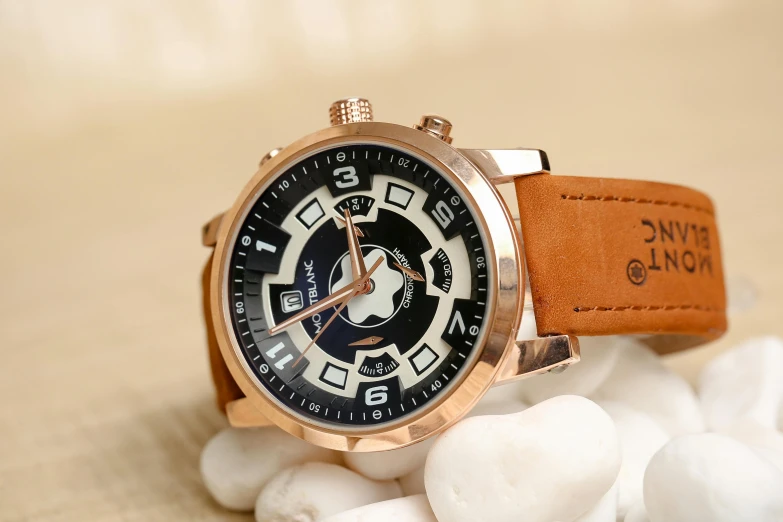 a wrist watch sitting on top of white rocks