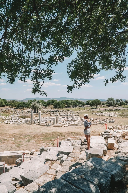 two men standing around a field with rocks