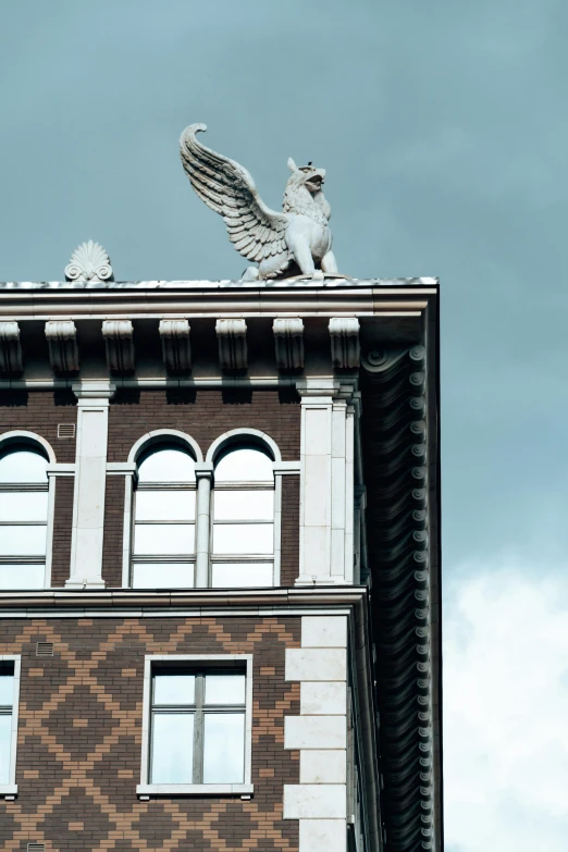 there are birds perched on the top of a building