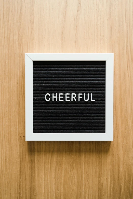 a sign saying cheerful mounted on a wall