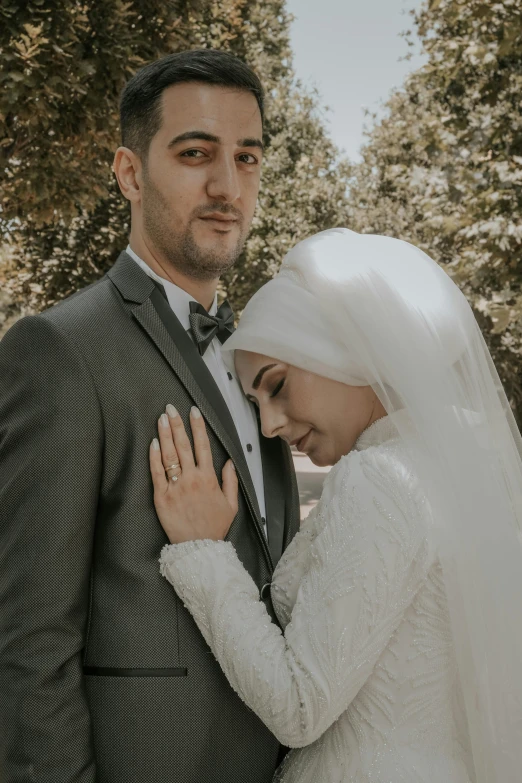 bride and groom emcing each other during their wedding po