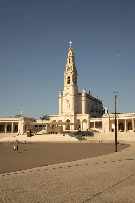 a large clock tower in the middle of a courtyard