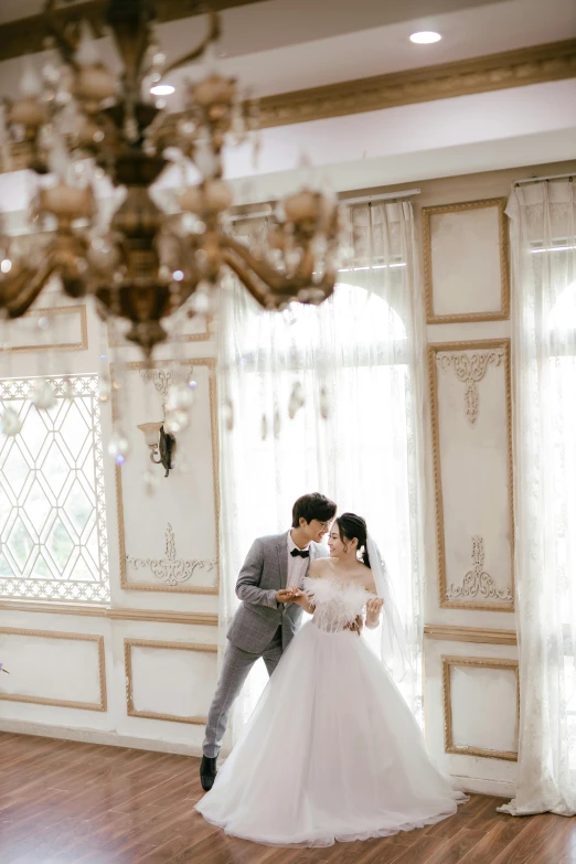 an image of a bride and groom taking a first look