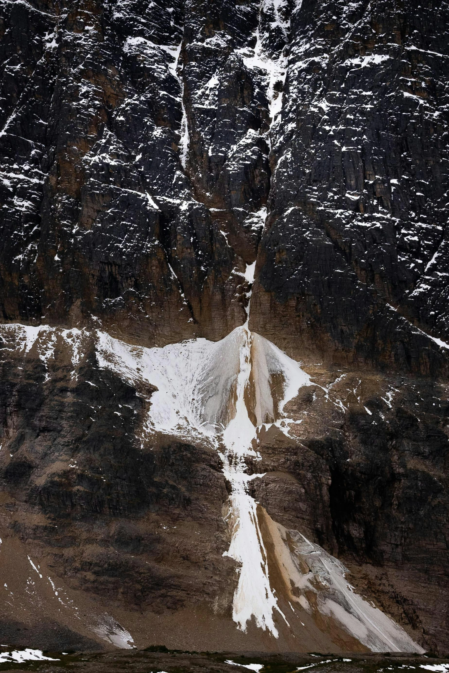 a snow covered mountain peak under a clear sky