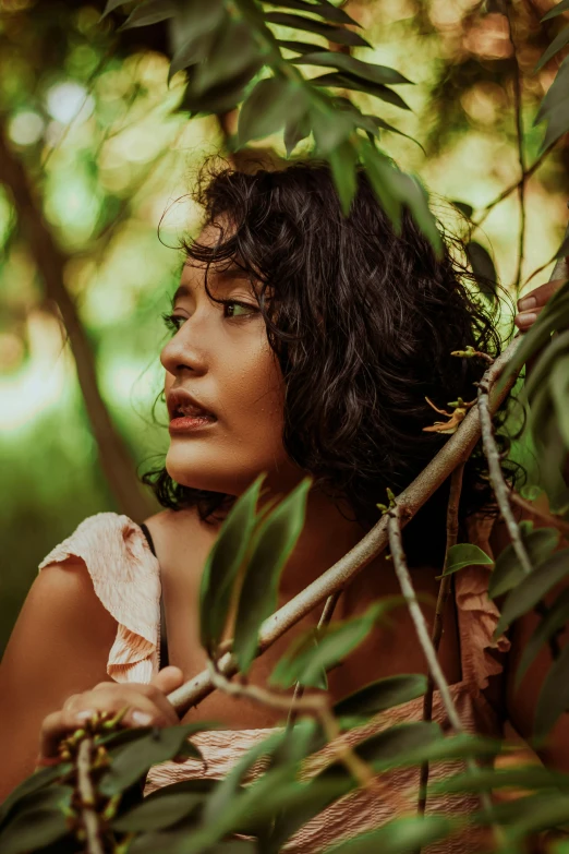 young asian woman in white blouse in the woods