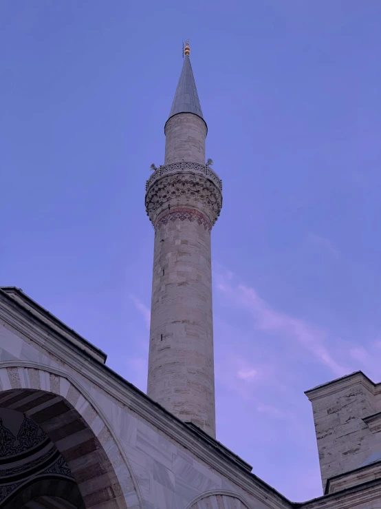 the tall clock tower towering over a large building