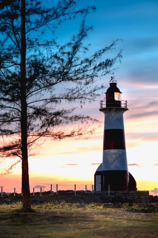 the lighthouse is lit at night with its light on