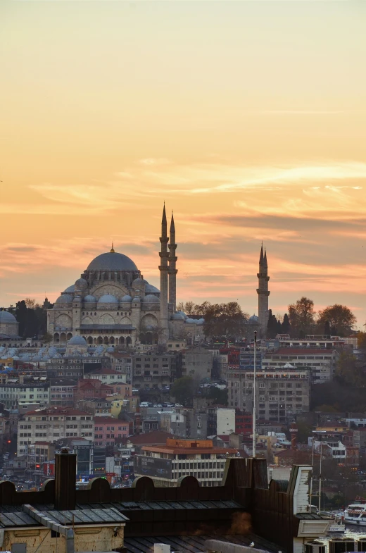 a sunset view of the skyline of a large city