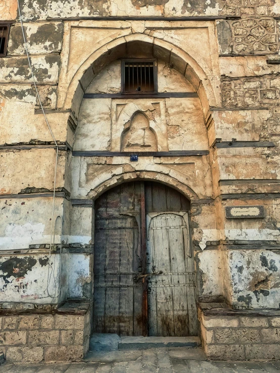 a large doorway with a few bars attached to it