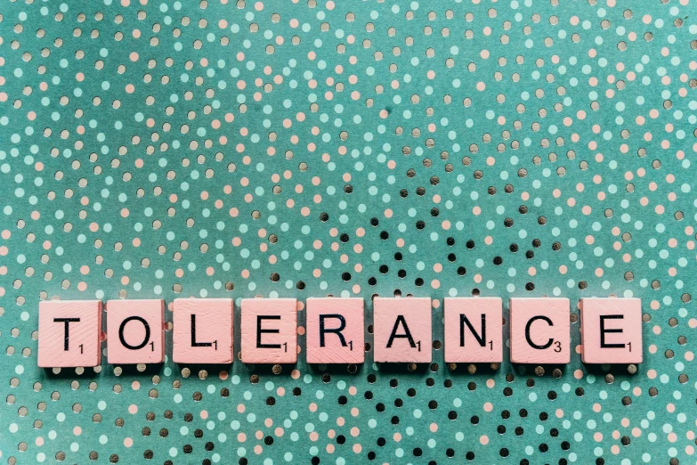 letters spelling the word tollance written in small tiles