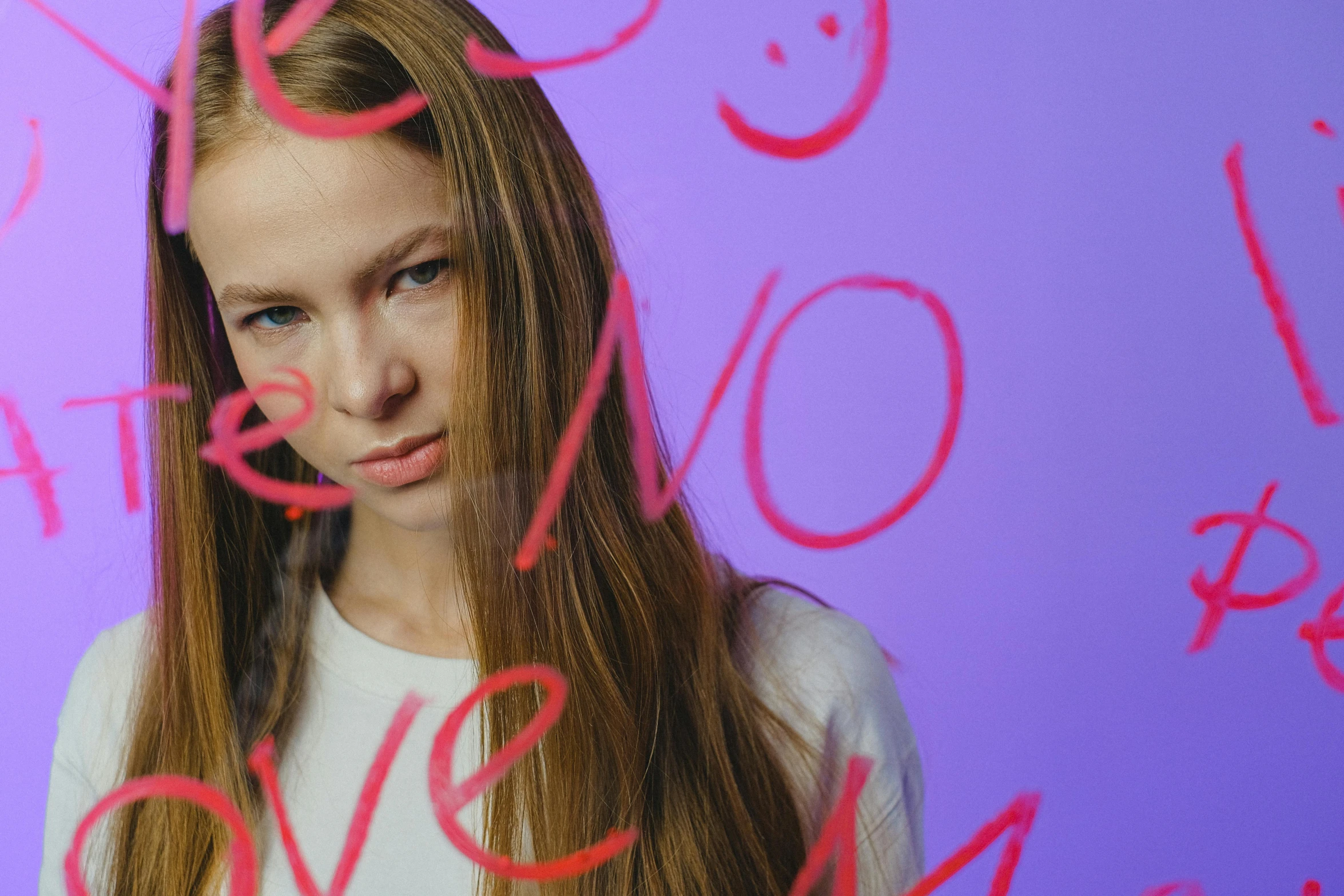 a woman with long hair posing for a po