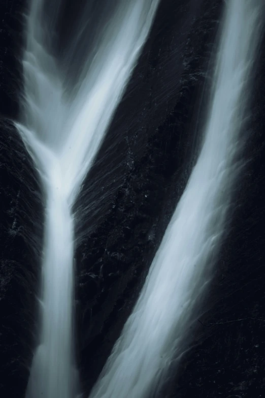 a black and white po of a waterfall