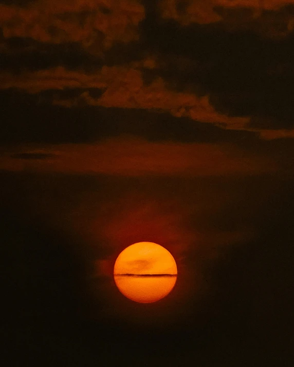 the sun is seen through clouds with only one sun in view