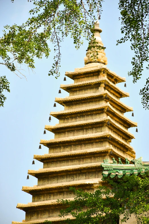 a tall pagoda building with many windows on top