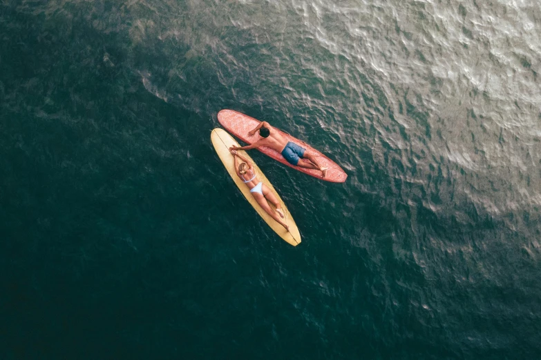 a man rows a canoe across the ocean