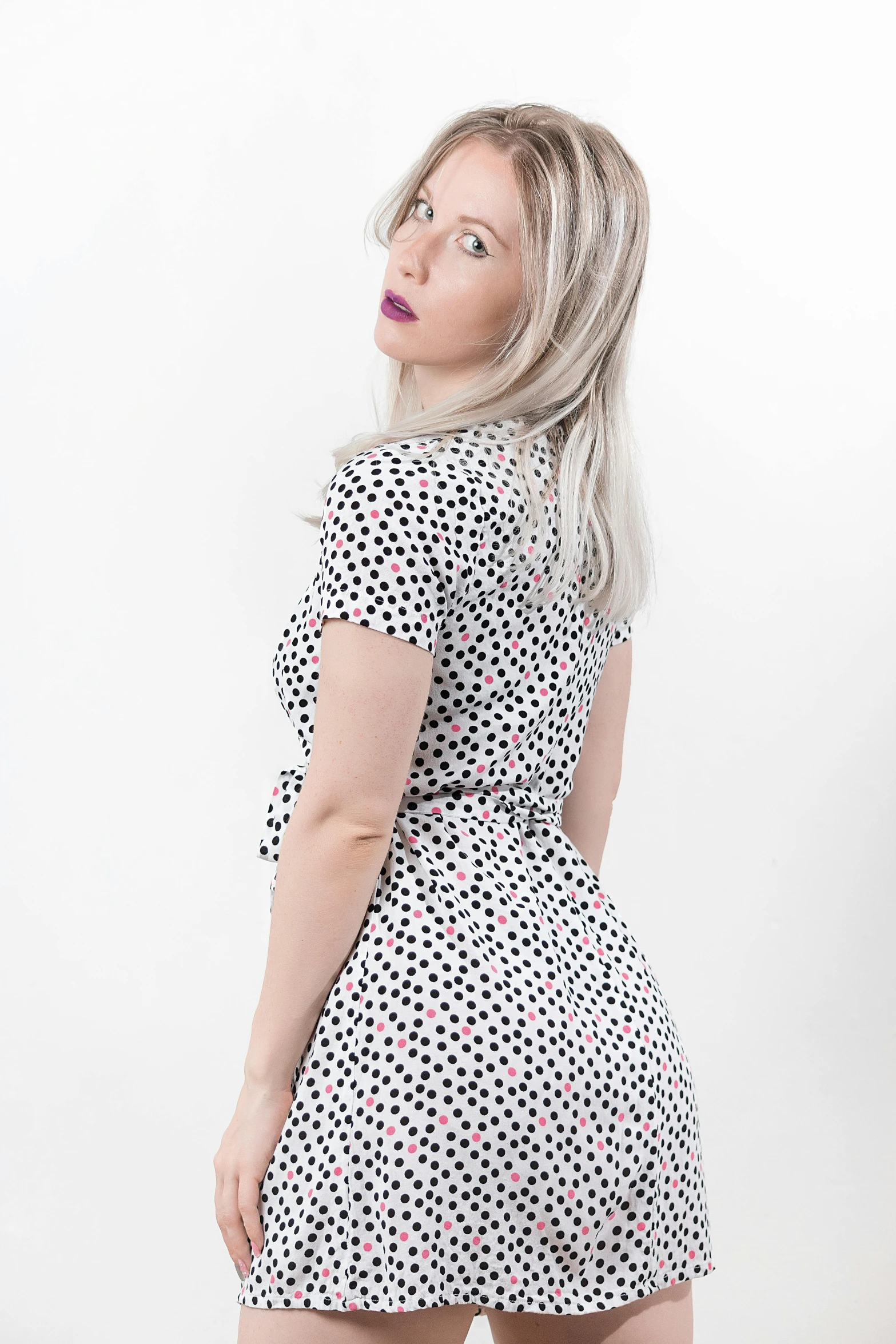 the back of a young woman wearing a short dress