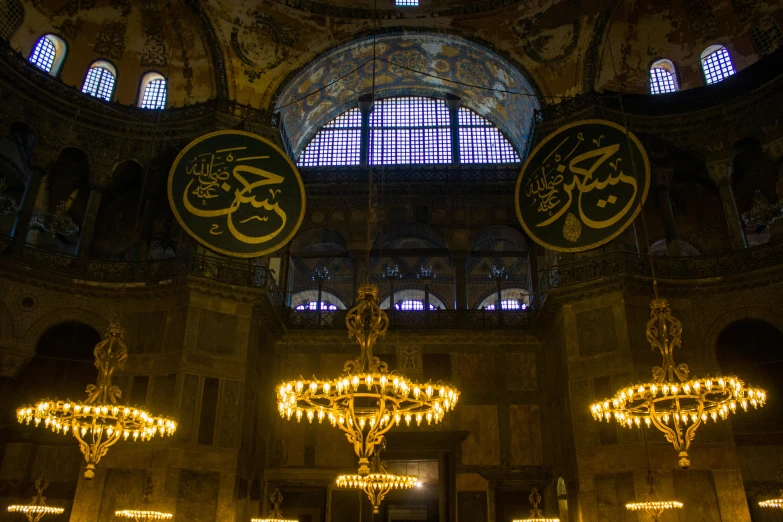 an ornate room with chandeliers and big windows