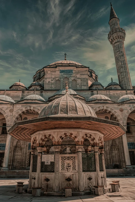 a large white building with domes and arches