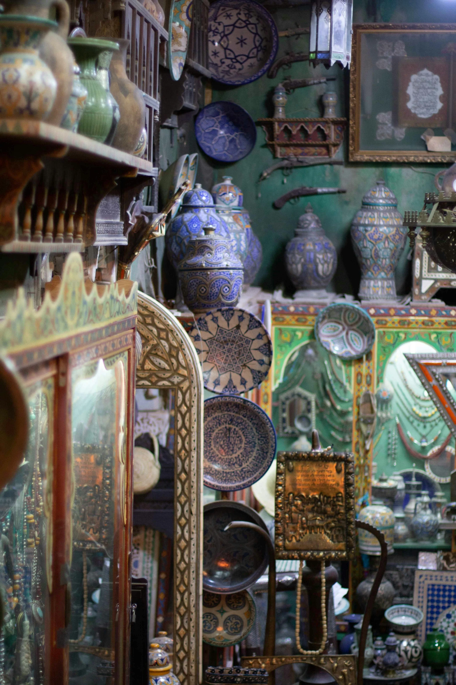 many bowls and vases are on display inside a store