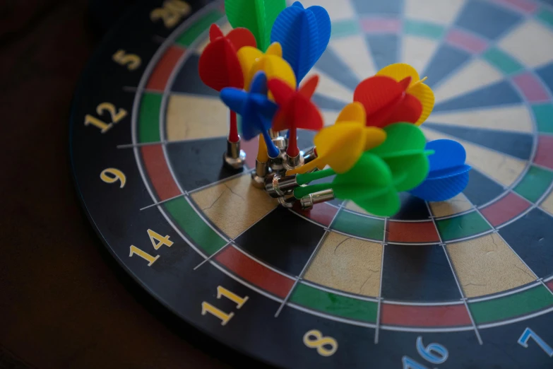 colorful pins on a dart board with numbers