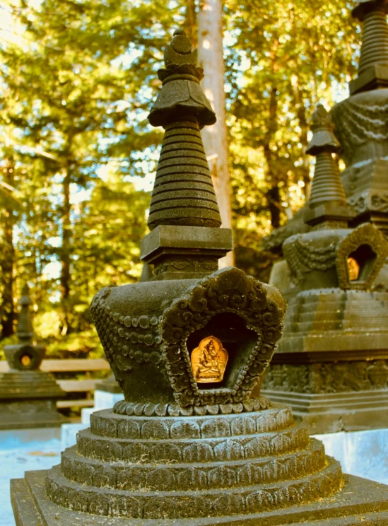 a sculpture is shown in the sun, in a park