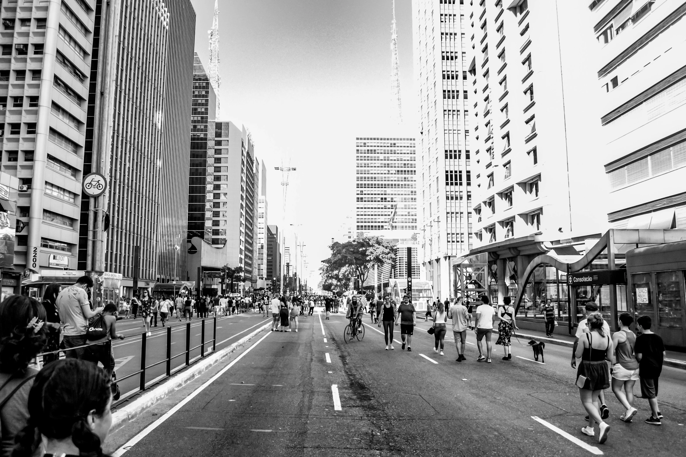 people on the street with buildings in the background