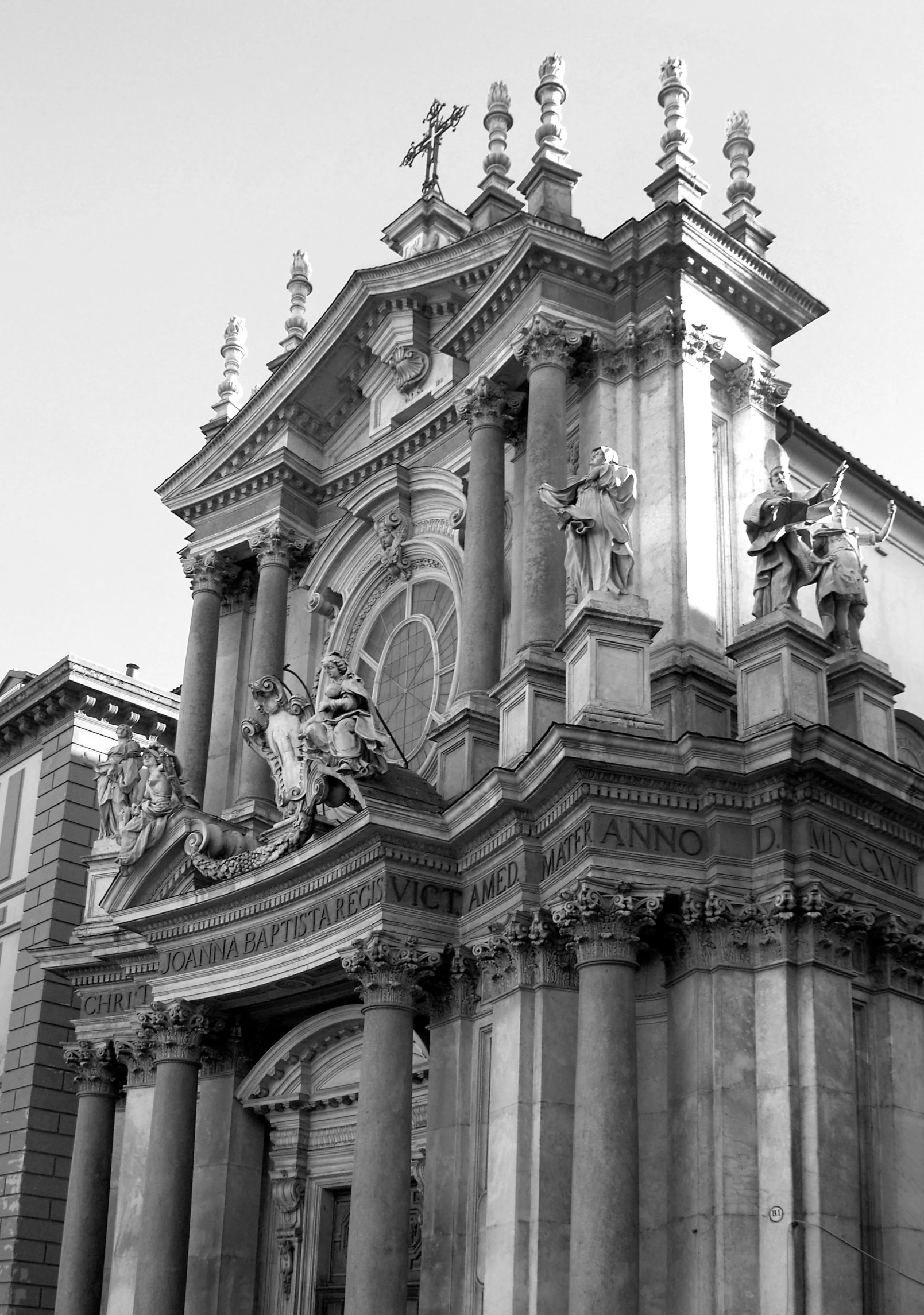 a big black and white clock tower on top of a building