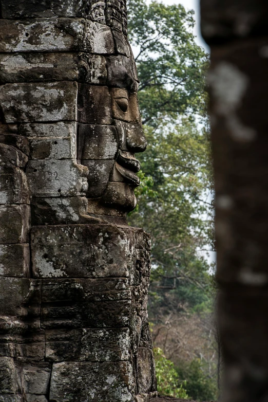 stone faces on the side of some brick structures