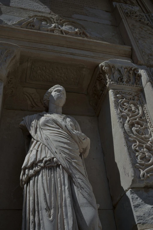 an architectural stone statue in front of a building