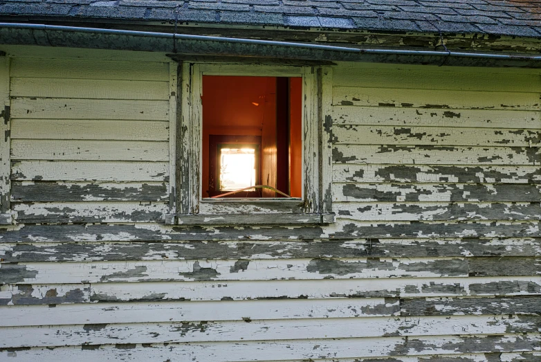 the sun shining through the window of a house