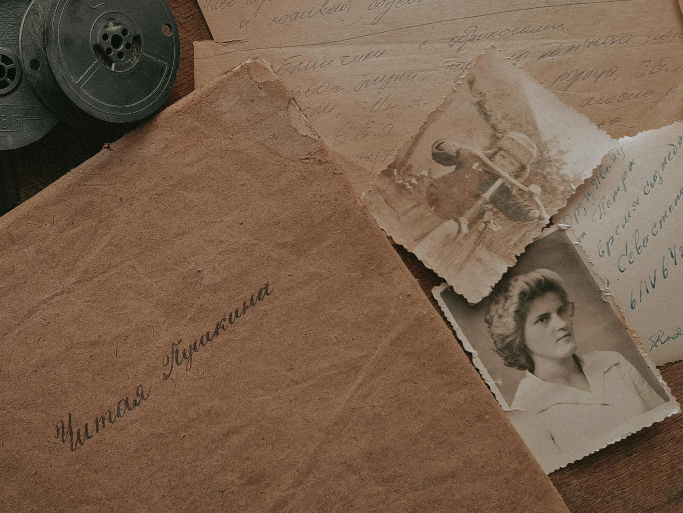 two twin - ribbons and several paper images are sitting on a table