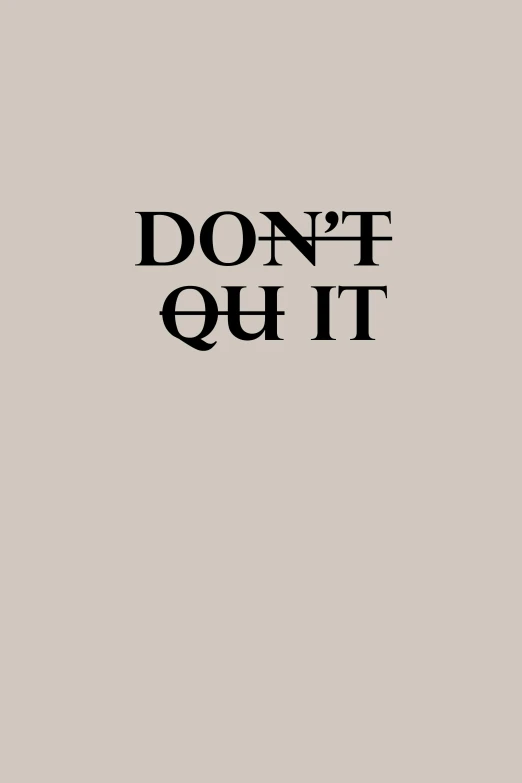 the text don't quit sits in front of a white wall