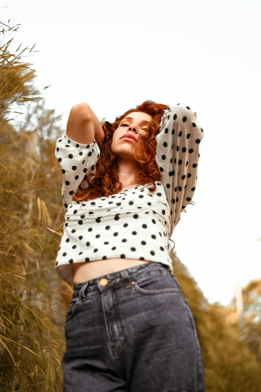 an image of a woman wearing high waist jeans