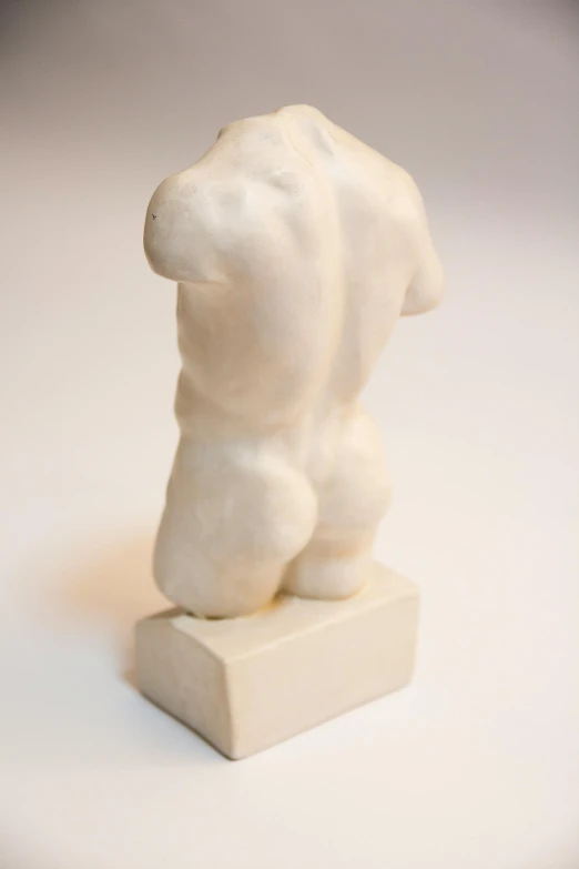 a white sculpture sitting on top of a white surface